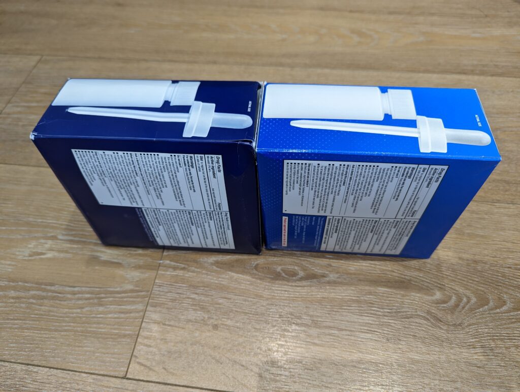 Member's Mark 生髮水 (左) 與 Kirkland 生髮水 (右) 的外盒頂部實拍對比，兩者印有完全相同的 1:1 滴管實體比例圖。